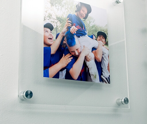 clear picture frame with a sports photo and using standoffs to attach to the wall