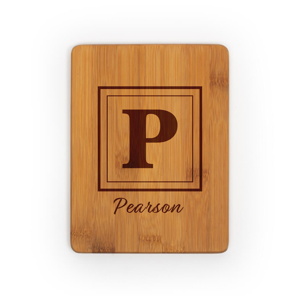 Rectangular cutting board without a handle engraved with monogram of P and Pearson