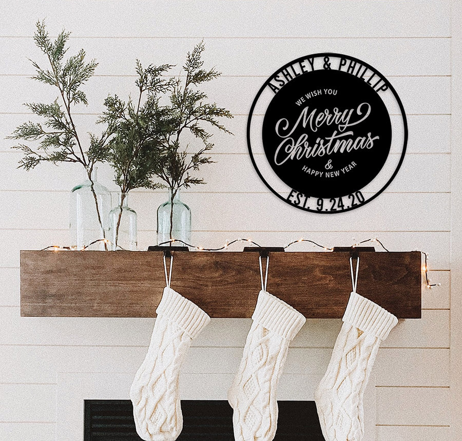 personalized holiday sign hung above a shelf where stockings are hung