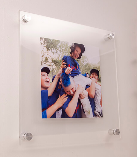 sport photo on display in a frame attached to the wall using standoffs
