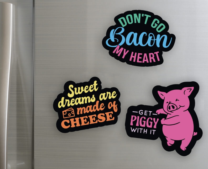 Front of steel refrigerator with magnets, Don't go bacon my heart, Sweet dreams are made of cheese, and a dancing pig Get piggy with it