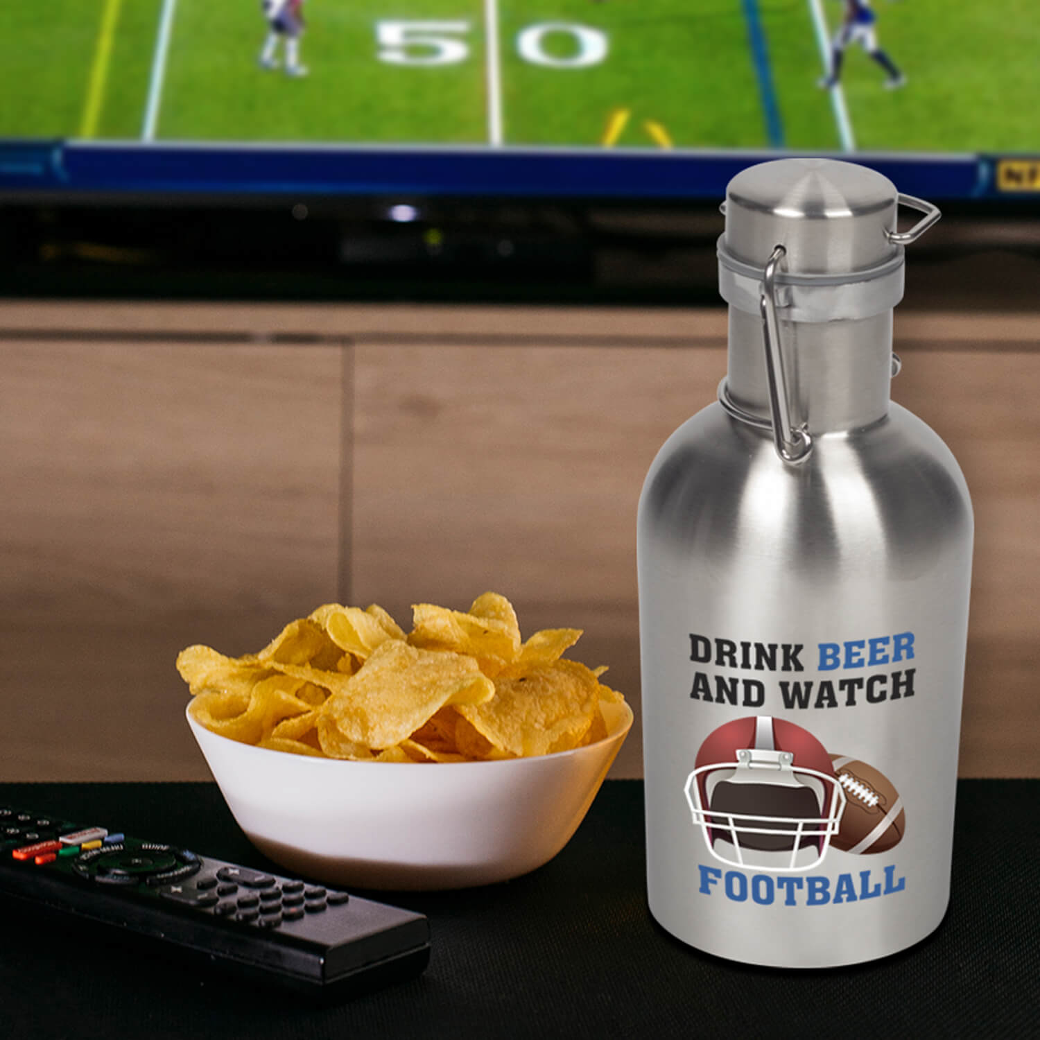 customized stainless steel growler on a table with a bowl of chips and a remote control
