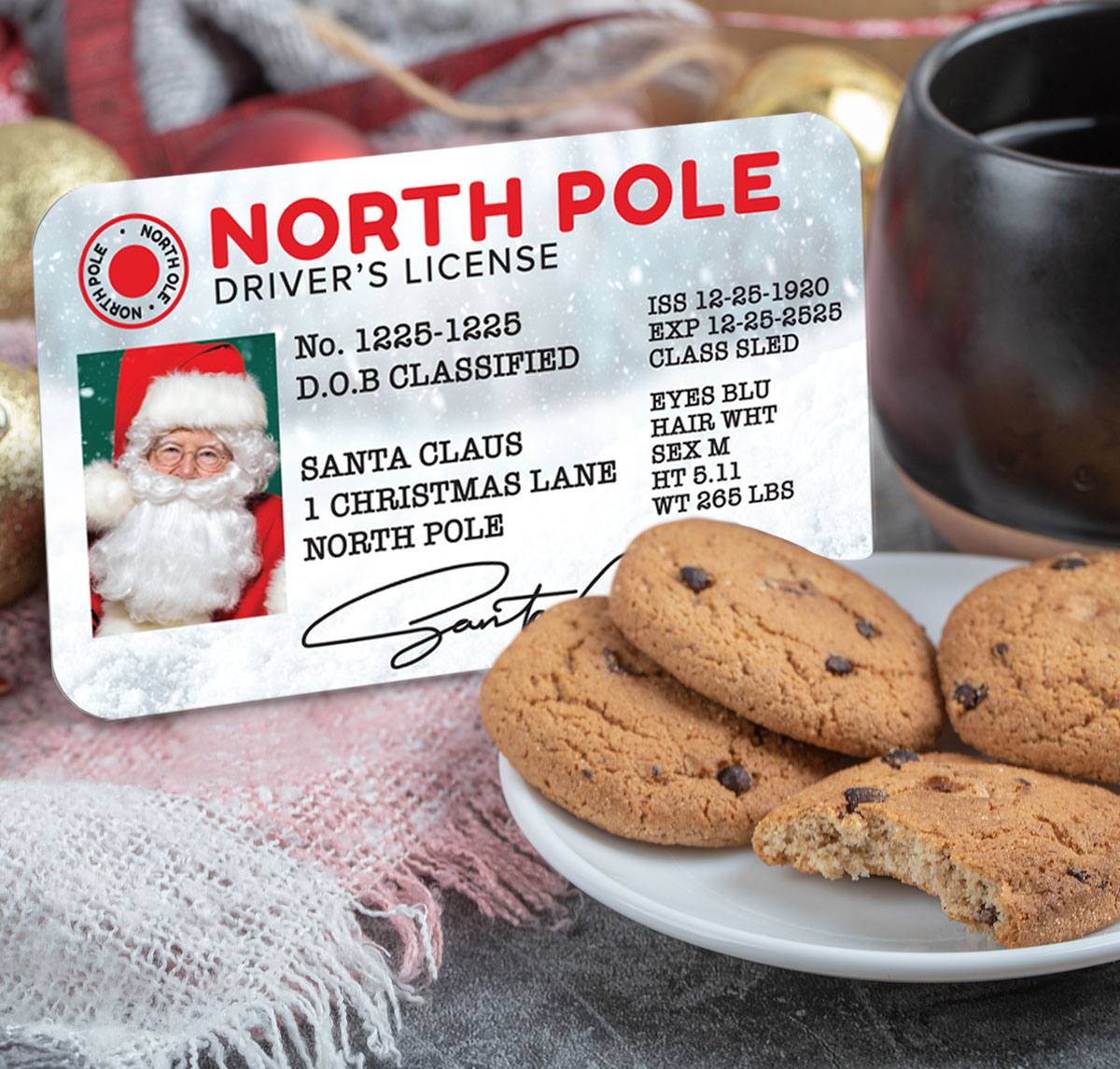 customized north pole driver's license sitting next to a plate of cookies