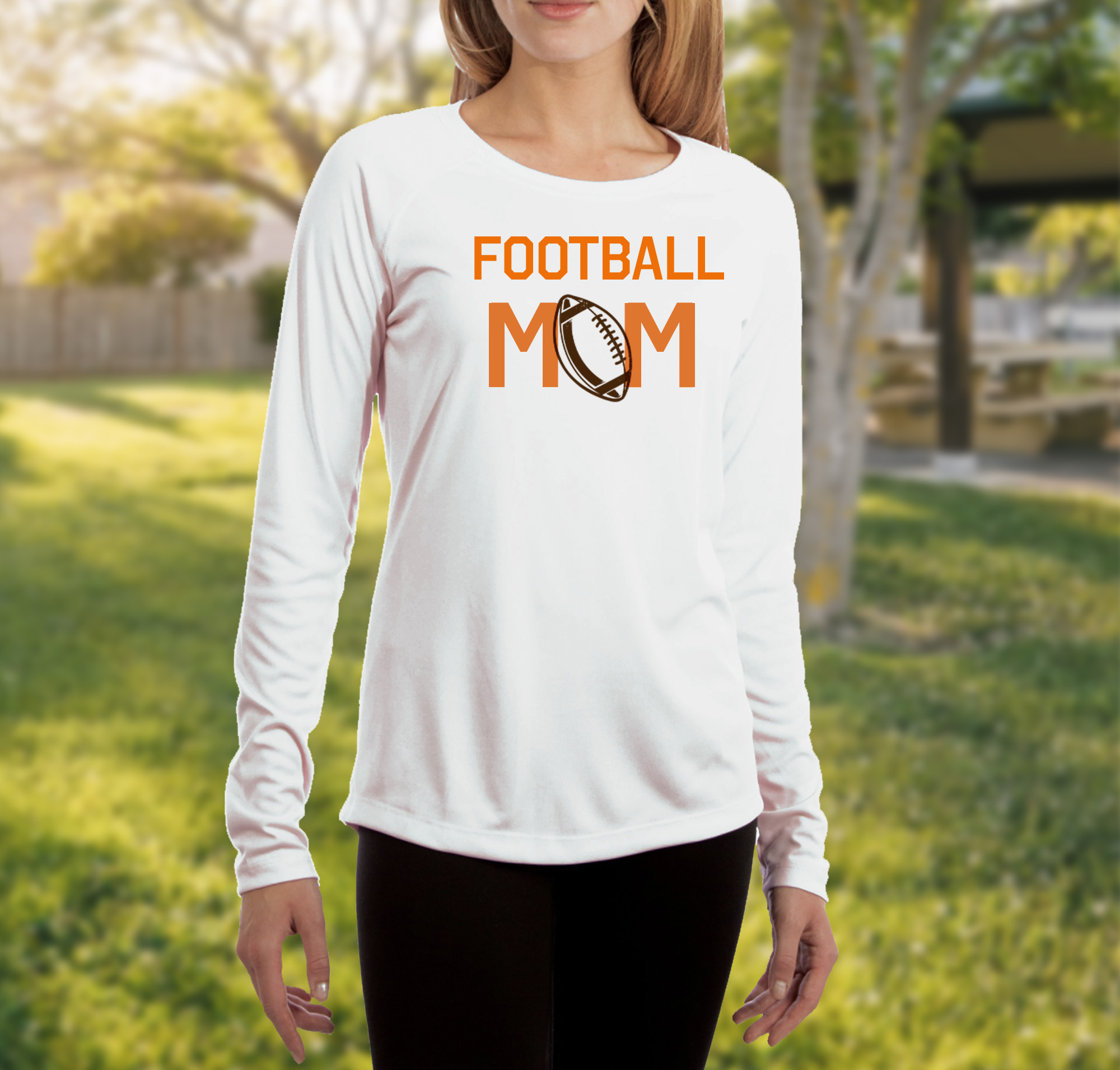 woman outside wearing personalized long sleeve shirt that says football mom