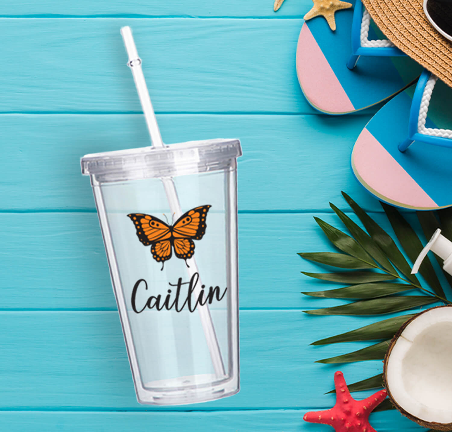 clear acrylic tumbler personalized with 'Caitlin' and a butterfly
