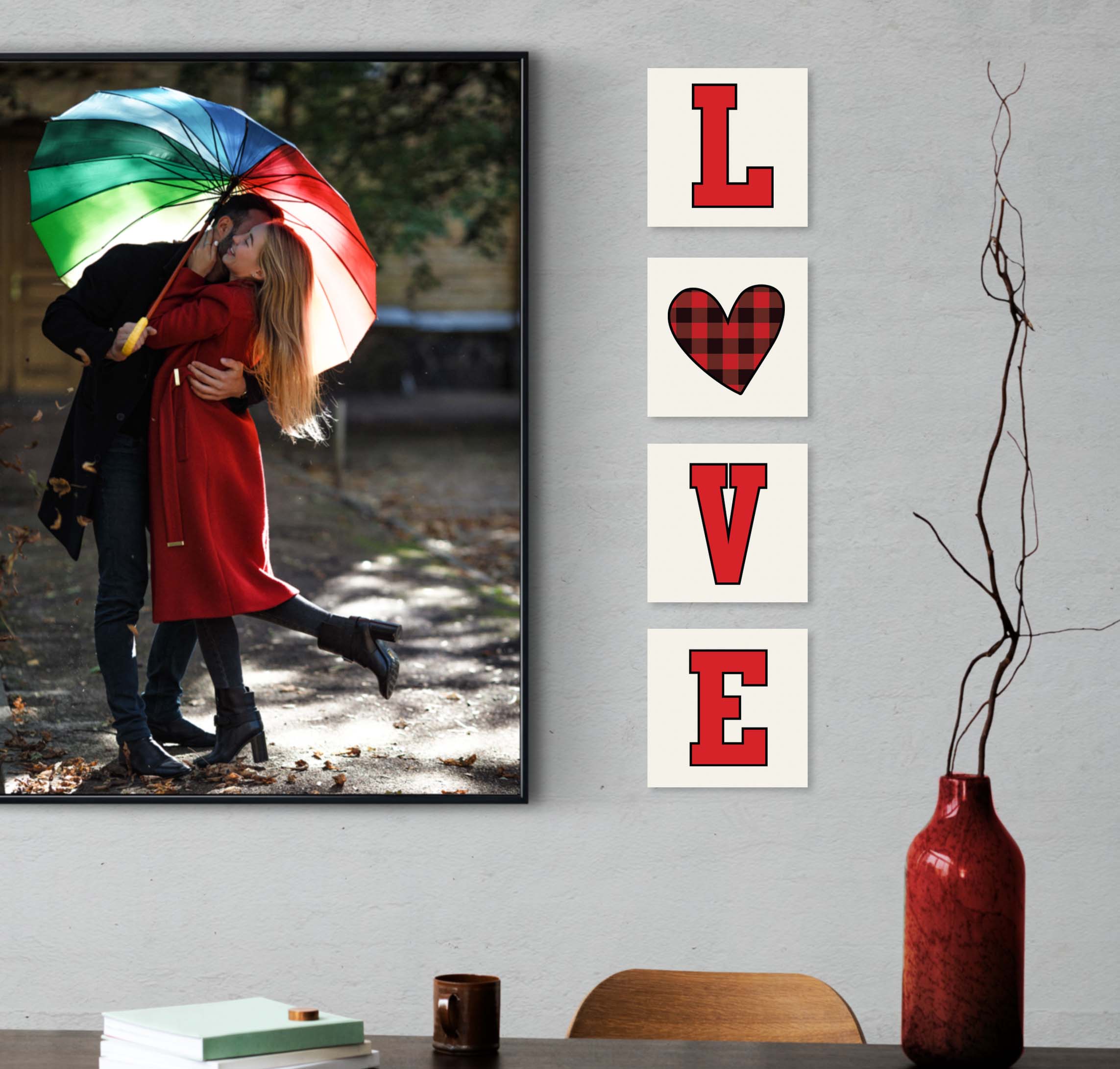 photo of a couple on the wall next to wooden plaques that spell out love