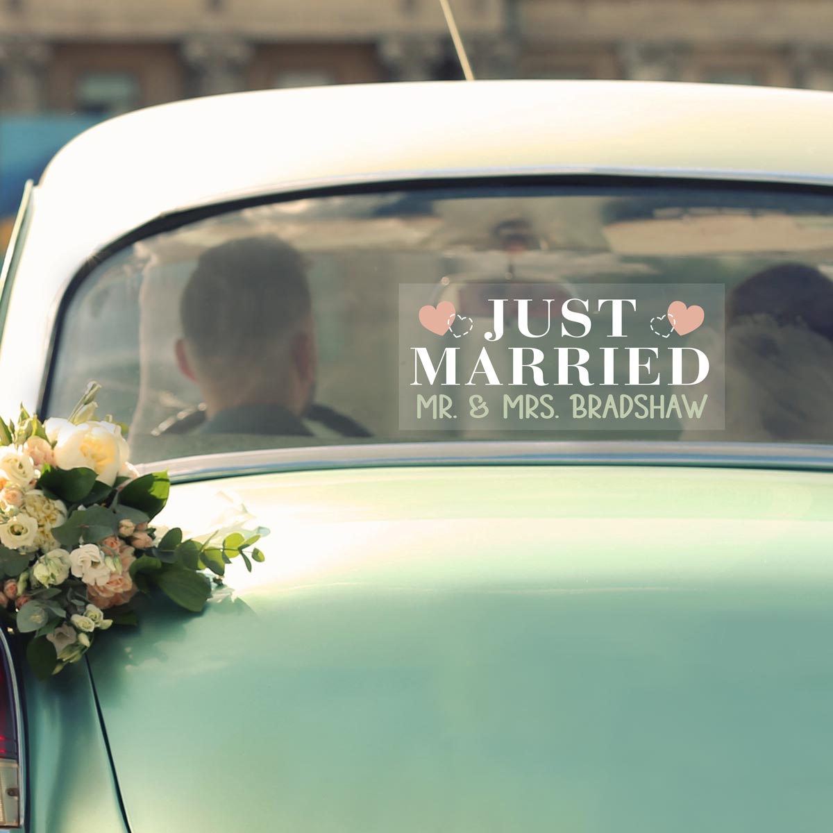 personalized just married window cling in the back window of a classic car