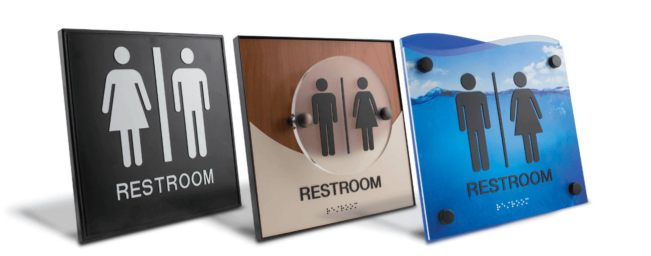Variety of restroom signs with braille